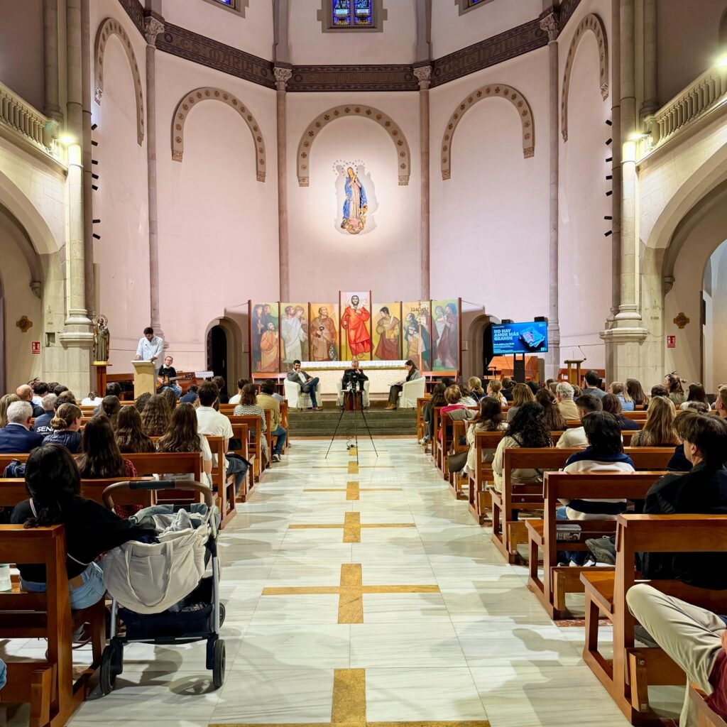 View from the back of the church, with the pews full of people during the presentation of the book